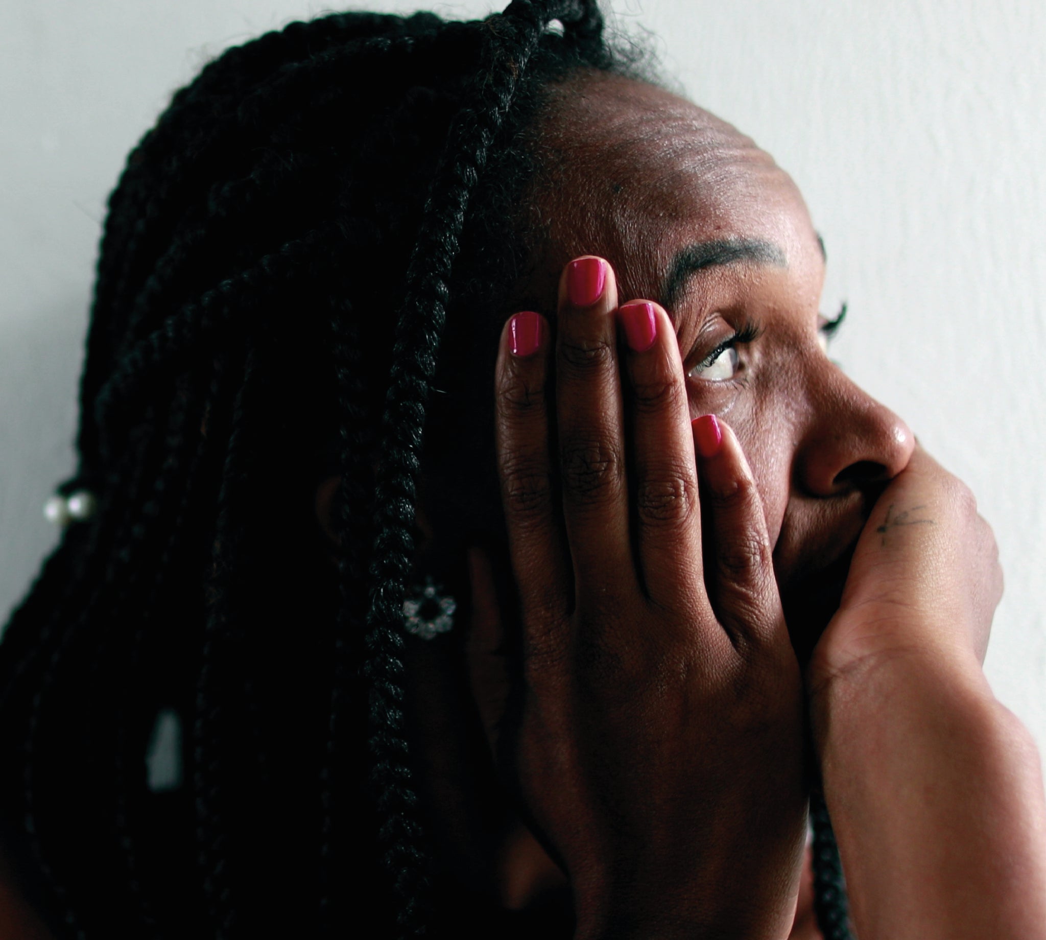 Stressed woman with hands on face